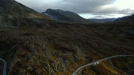 Aerial-over-the-road-and-rugged-landscape-near-Djupvattnet,-Geiranger,-Norway