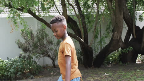 African-American-boy-enjoys-a-sunny-day-outdoors