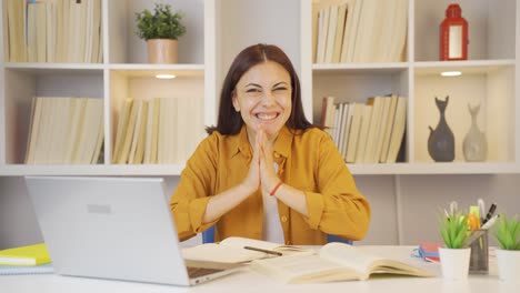 female student experiencing joy looking at camera.
