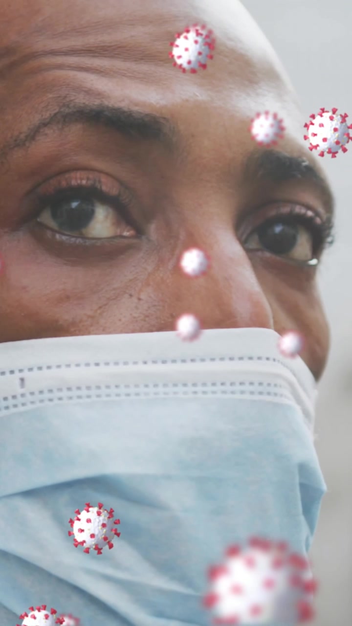 Black man wears mask in city for COVID-19 and pollution protection.