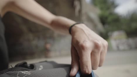 Unpacking-rock-climbing-backpack-for-tools-pov-shot