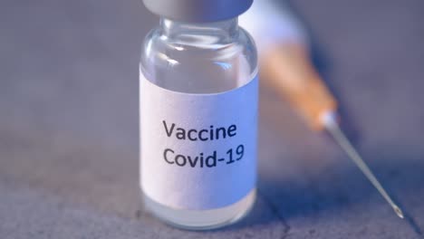 covid-19 vaccine vial and syringe