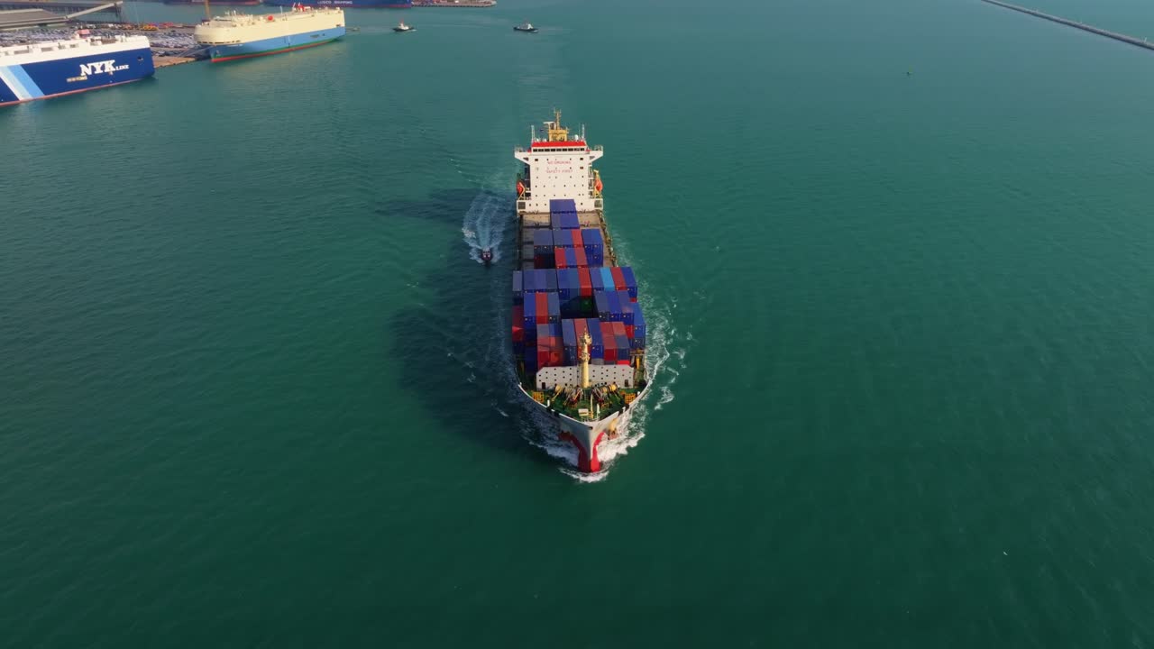 Shipping vessel leaving coastal port, Thailand