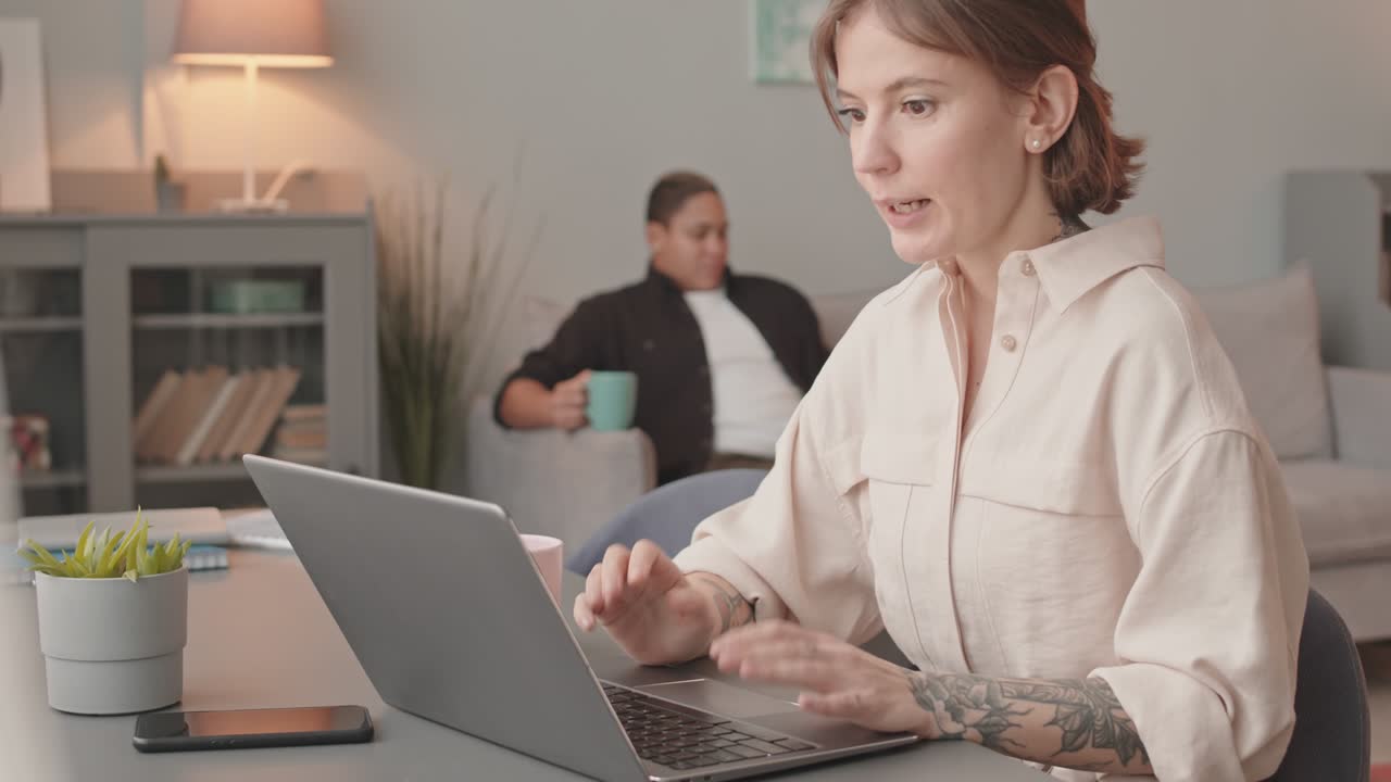 Woman Having Business Video Call on Laptop from Home