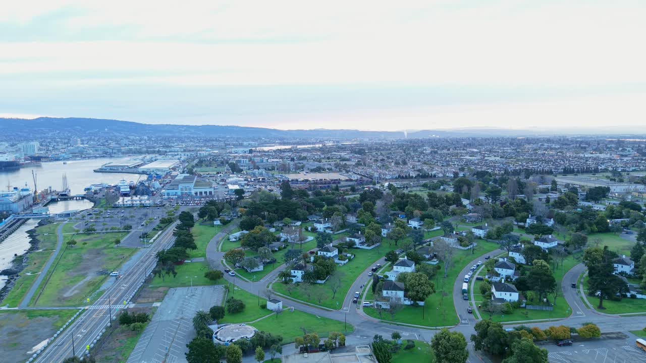 A slow aerial zoom out of Alameda Point during the morning.