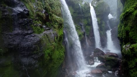 a stunning close-up of the multi-tiered waterfalls at quebrada gata in costa rica