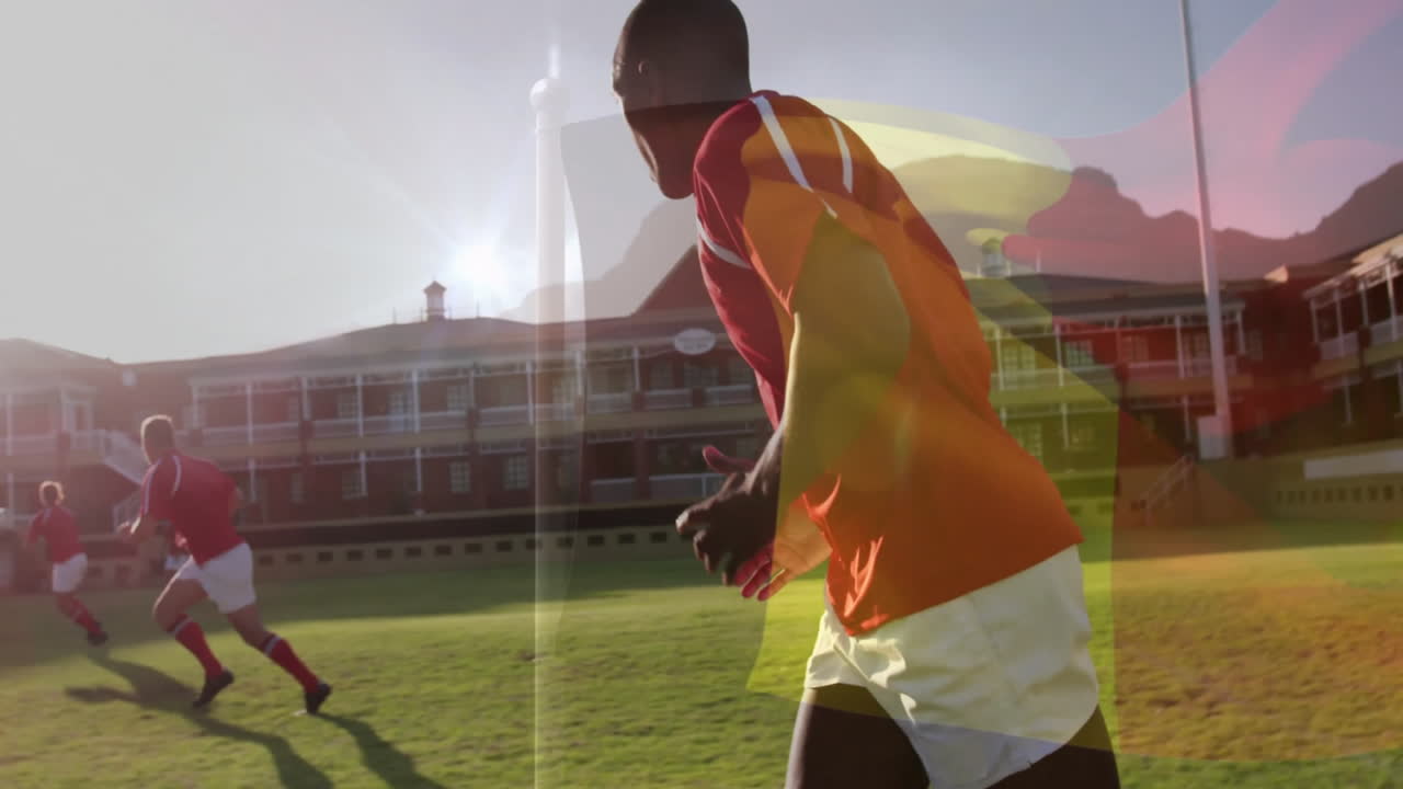 Running on field, rugby players with flag animation overlay in bright sunlight