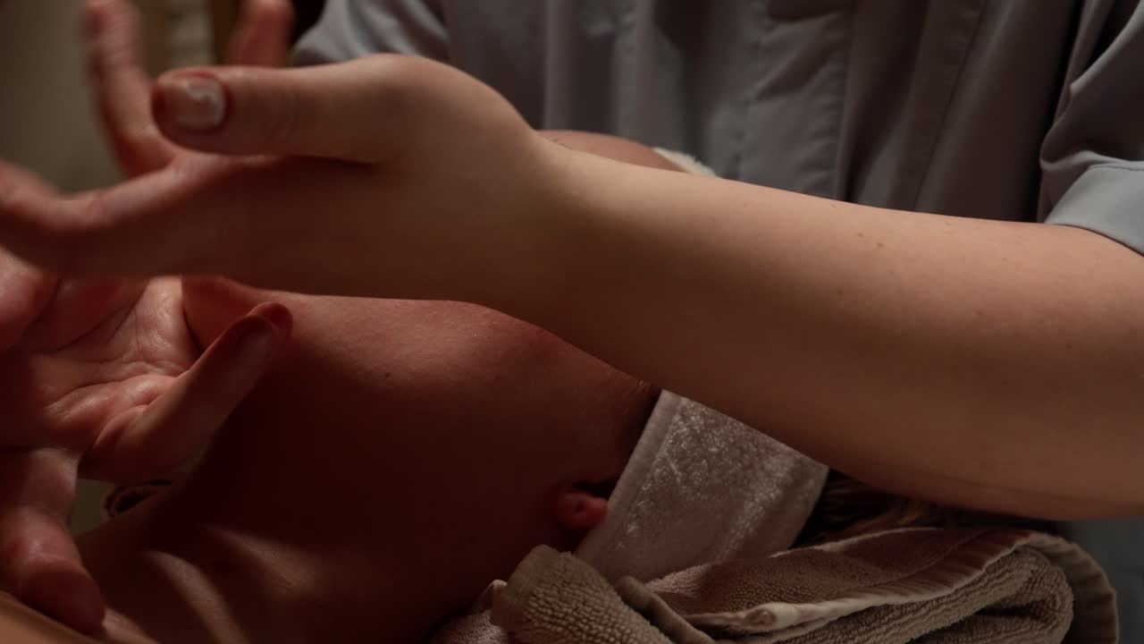 Woman Receiving Relaxing Facial Massage at a Spa