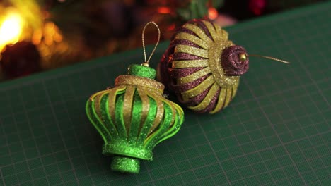 glitter foami christmas ornaments, on a green cutting mat