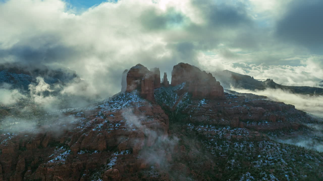 Red Sandstone Buttes Engulfed By Misty Clouds At Sunrise In Sedona, Arizona. Timelapse