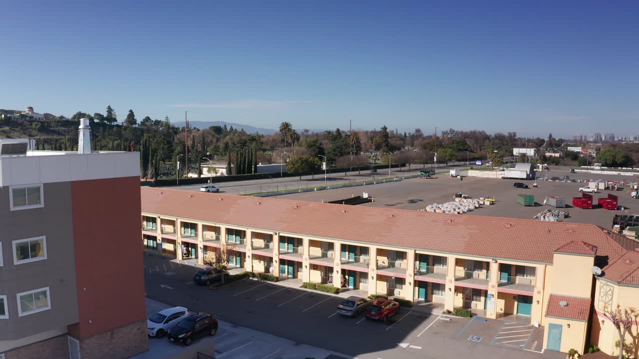 Low rising aerial shot of a budget motel in central San Jose, California. 4K