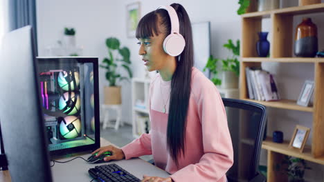 Female-gamer-streaming-and-gaming-on-her-computer