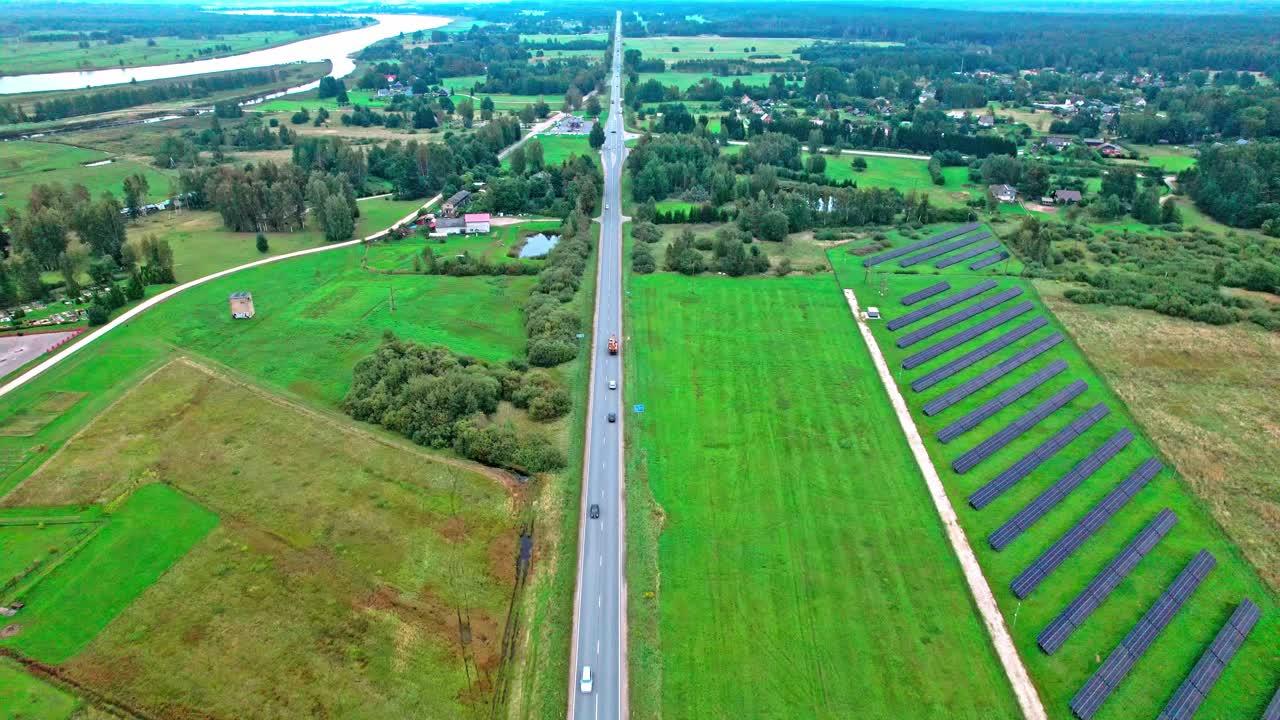 Expansive aerial view of solar panels and rural landscape in Latvia