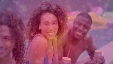 smiling friends enjoying drinks by pool with colorful bokeh animation overlay