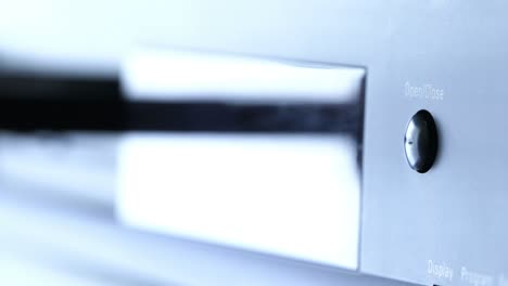 tape recorder close-up, a man presses the buttons