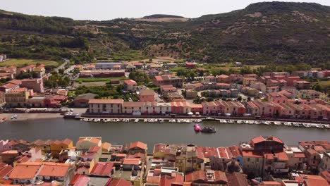 amazing aerial view of colorful houses in bosa by the river temo, sideways