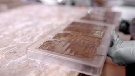 crop unrecognizable woman forming chocolate in kitchen