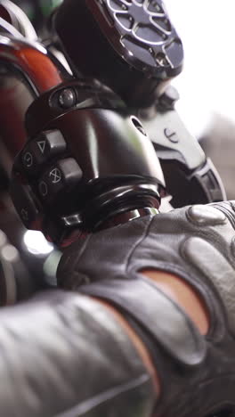 close-up of motorcycle handlebars and gloves