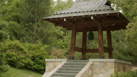 traditional asian bell tower in peaceful garden