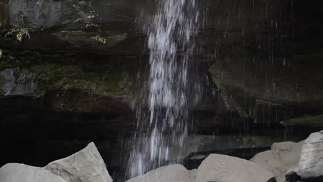 waterfall with dark background and granite rocks