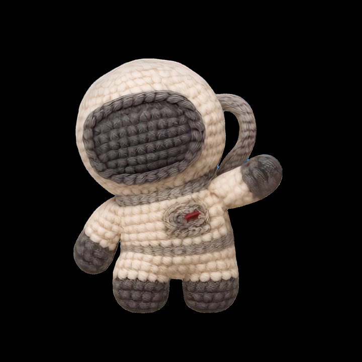 Hæklet astronautlegetøj, der vinker mod sort baggrund