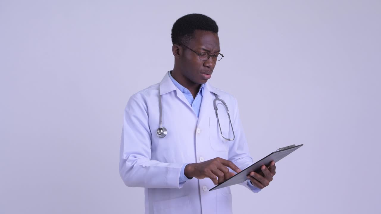 Young handsome African man doctor