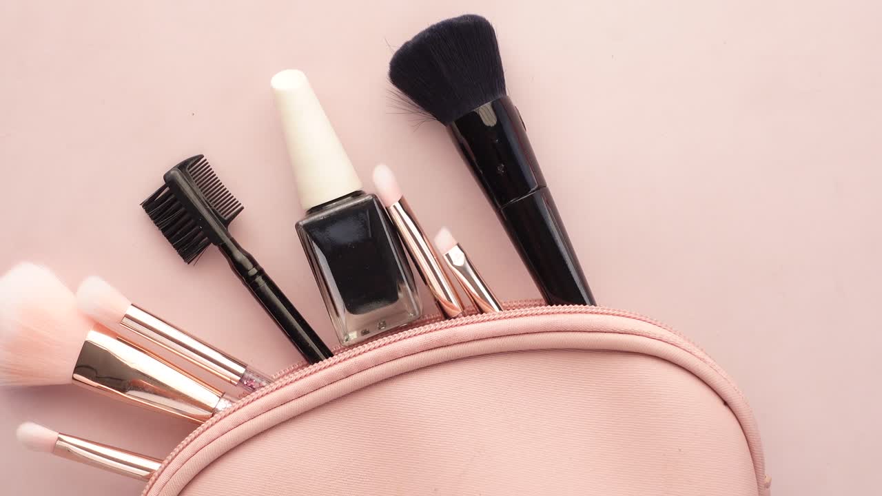 Top view of decorative black  cosmetic on dark background