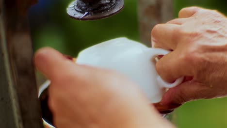 Placing-the-Crushed-Apple-Puree-in-the-Bag-to-Press