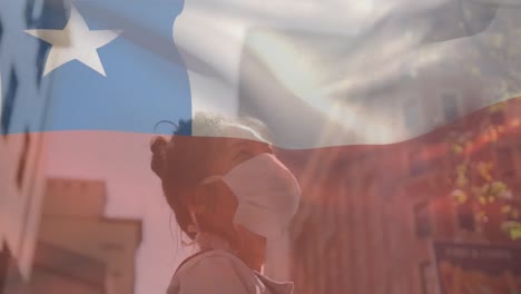 Animation-of-flag-of-chile-waving-over-woman-wearing-face-mask-during-covid-19-pandemic