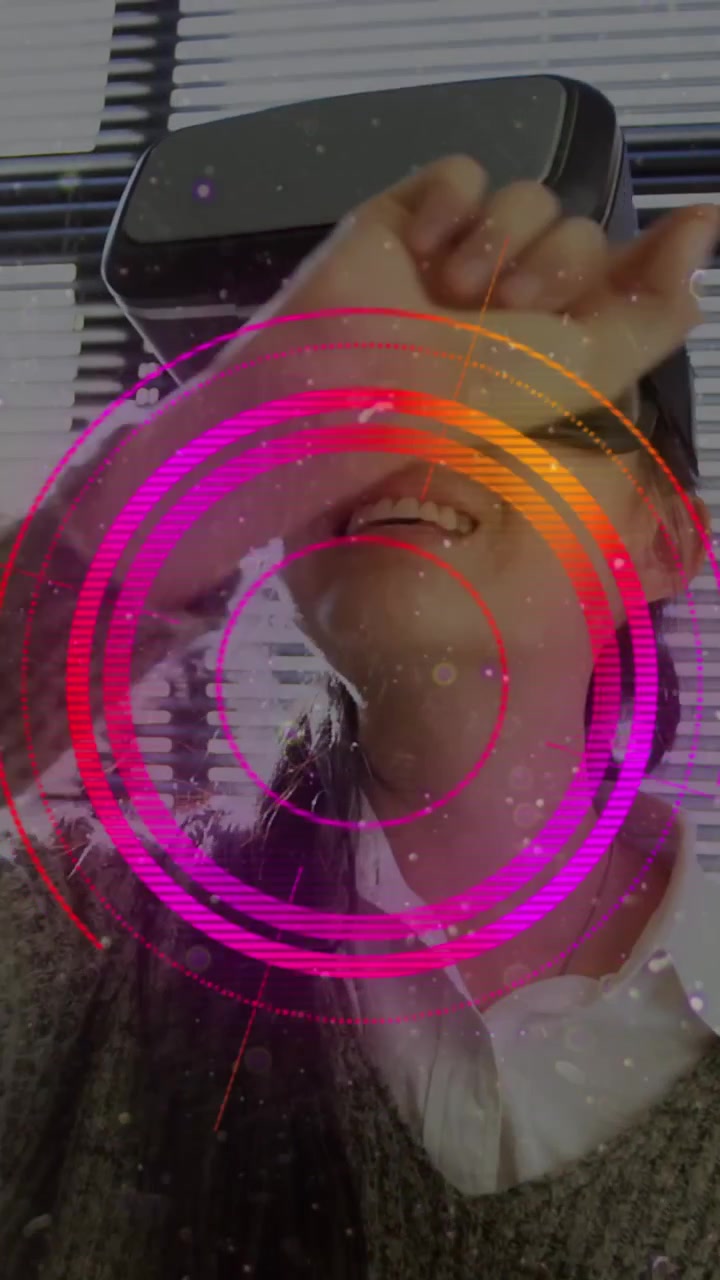 Light trails over scope scanner against asian woman gesturing while wearing vr headset at office