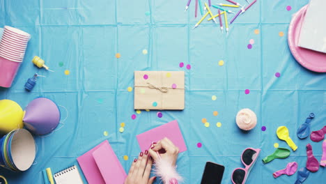 top view woman planning birthday party writing in card hands from above - red epic dragon