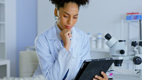 woman, tablet and thinking for scientific