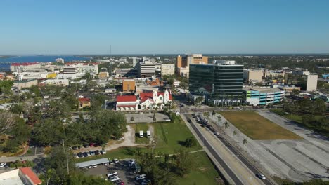 aerial view of downtown city with river and buildings