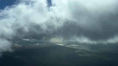 Pilot-point-of-view-while-flying-near-Gulf-of-Cadiz,-Spain,-during-descent,-with-a-blue-sunny-sky-flying-southward