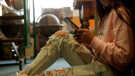 Teenage-girl-using-digital-tablet-in-library-4k