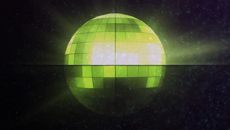 green and yellow disco ball glowing with light animation over dark background
