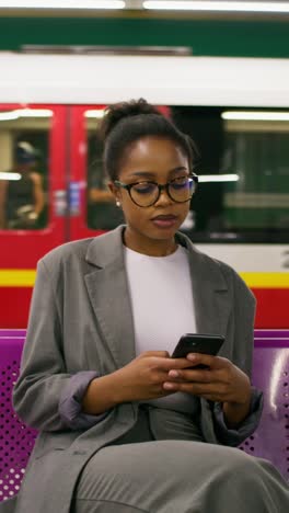 woman waiting at a metro station