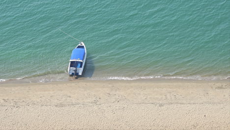 anchored boat on sea near beach