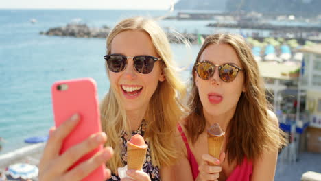 friends enjoying ice cream at the beach