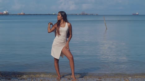 a young girl, adorned in a beach dress, savors the delights of a sunny caribbean beach day