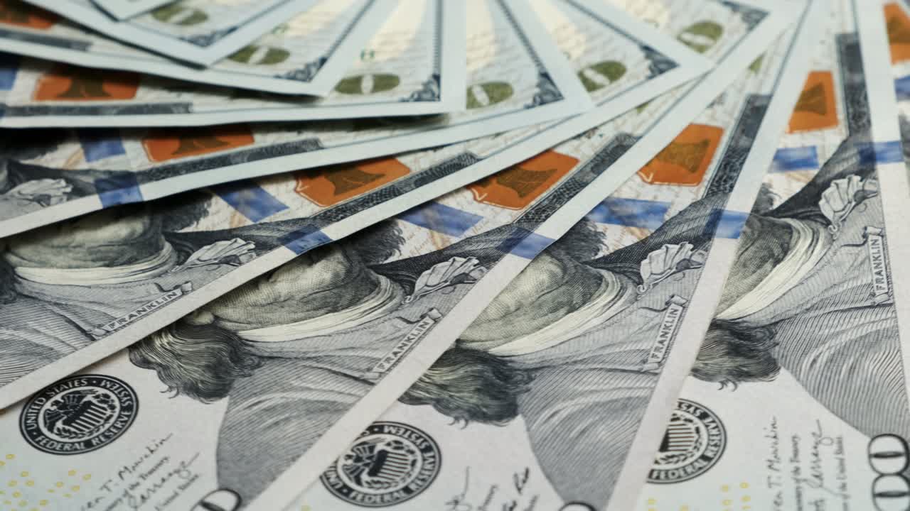 cierre de la moneda billetes de dólar de estados unidos. ingresos y concepto de negocio.