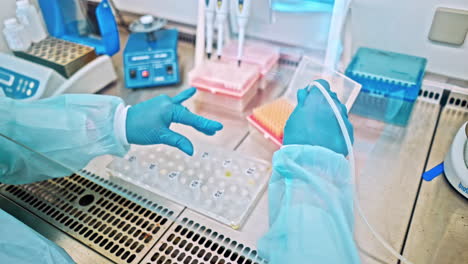 technician with tube of blood sample