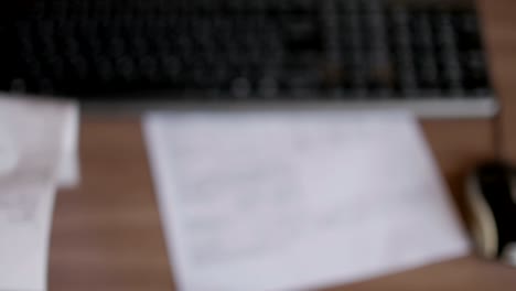 a man scans the qr code on a check from a supermarket.