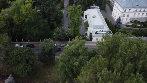 revealing drone shot of warsaw poland in a city forest in praga district