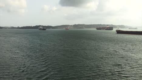 commercial ships waiting in the gatun lake to transit the panama canal locks