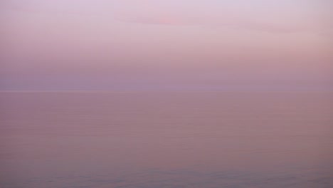 looped video. majestic sunset and calm mirrored water surface.