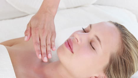 calm woman receiving reiki treatment