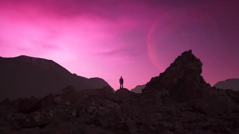 adventurous man hiker on a rocky, rugged peak