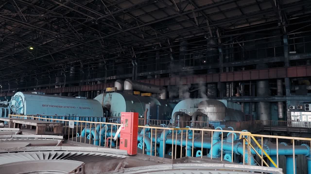 The engine turbine room of an old Soviet power plant. Steam turbine at coal-fired power plant to produce rotation for generator