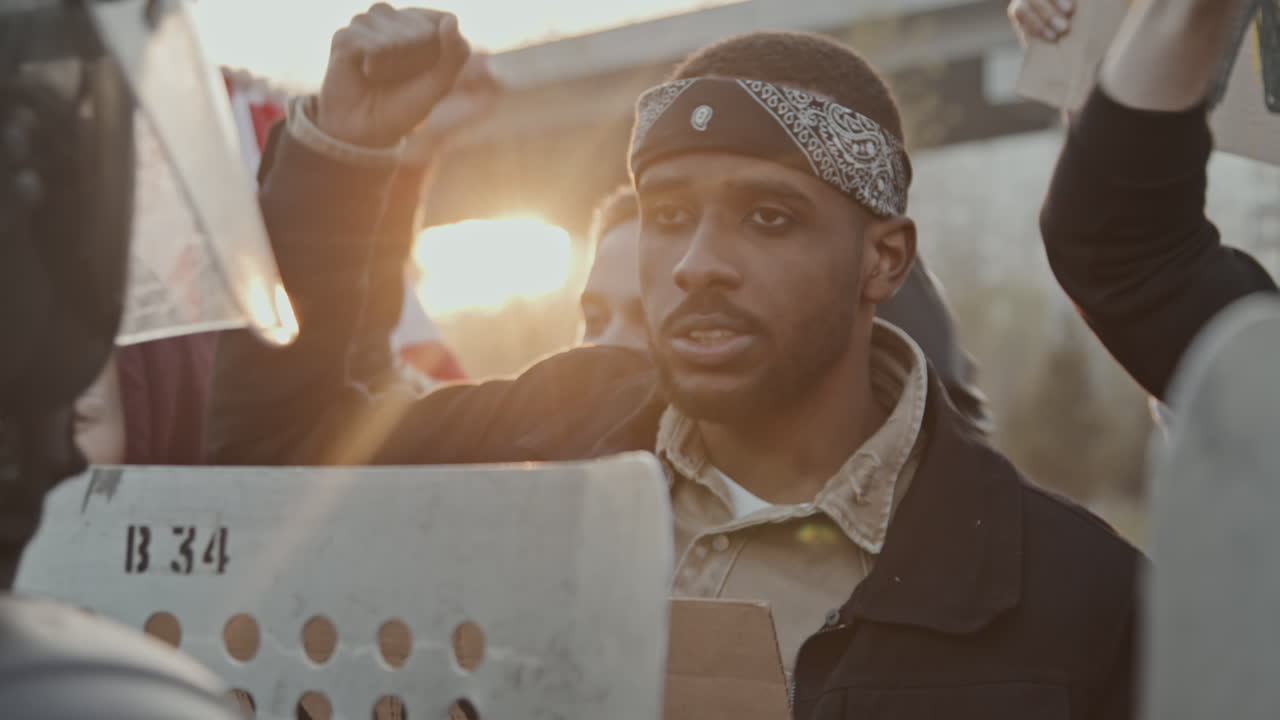 Images of a protest or demonstration with signs and people